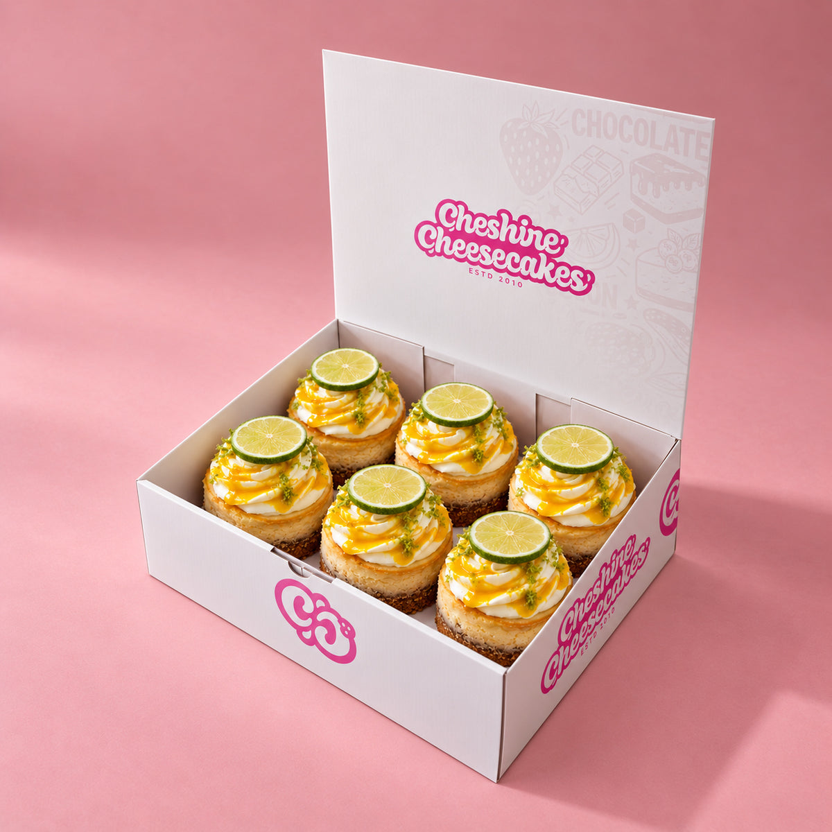 Mango & Lime Baked Cheesecake Box — box of 6 in blush studio, approved photographic hero