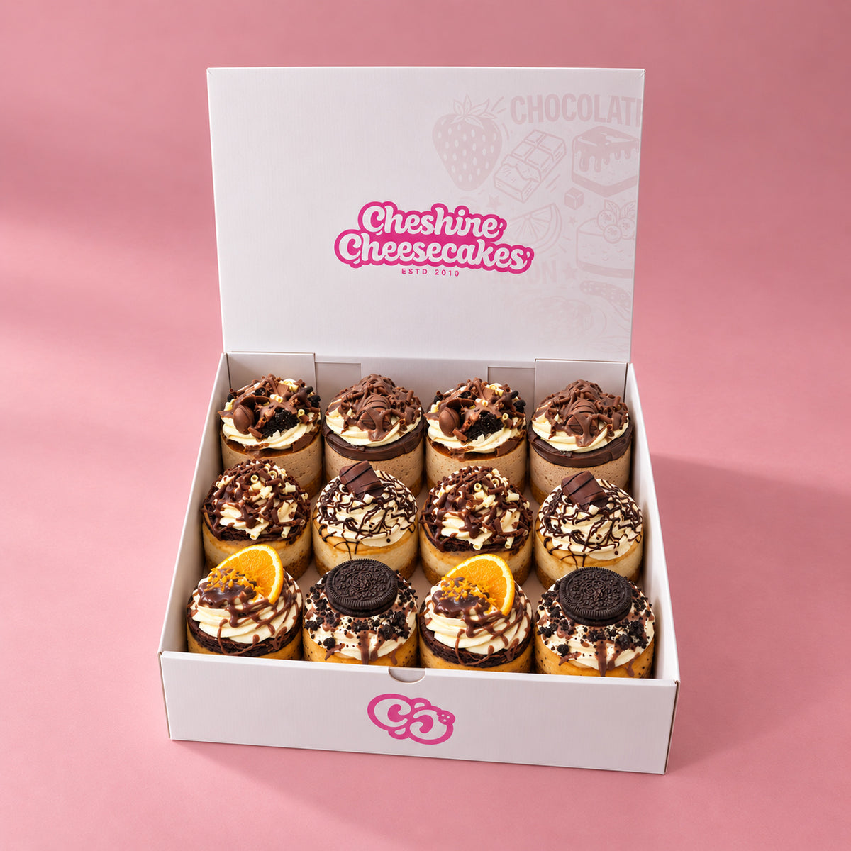 Chocolate Lovers Cheesecake Box: box of 12 cheesecakes in our branded open box on blush pink