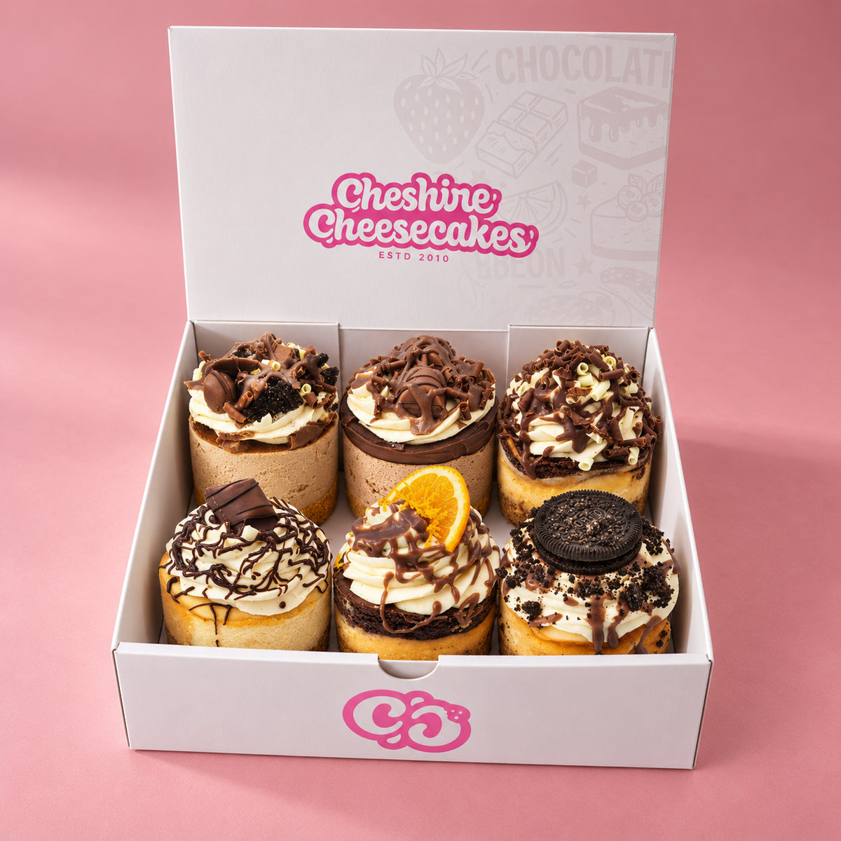 Chocolate Lovers Cheesecake Box: box of 6 cheesecakes in our branded open box on blush pink