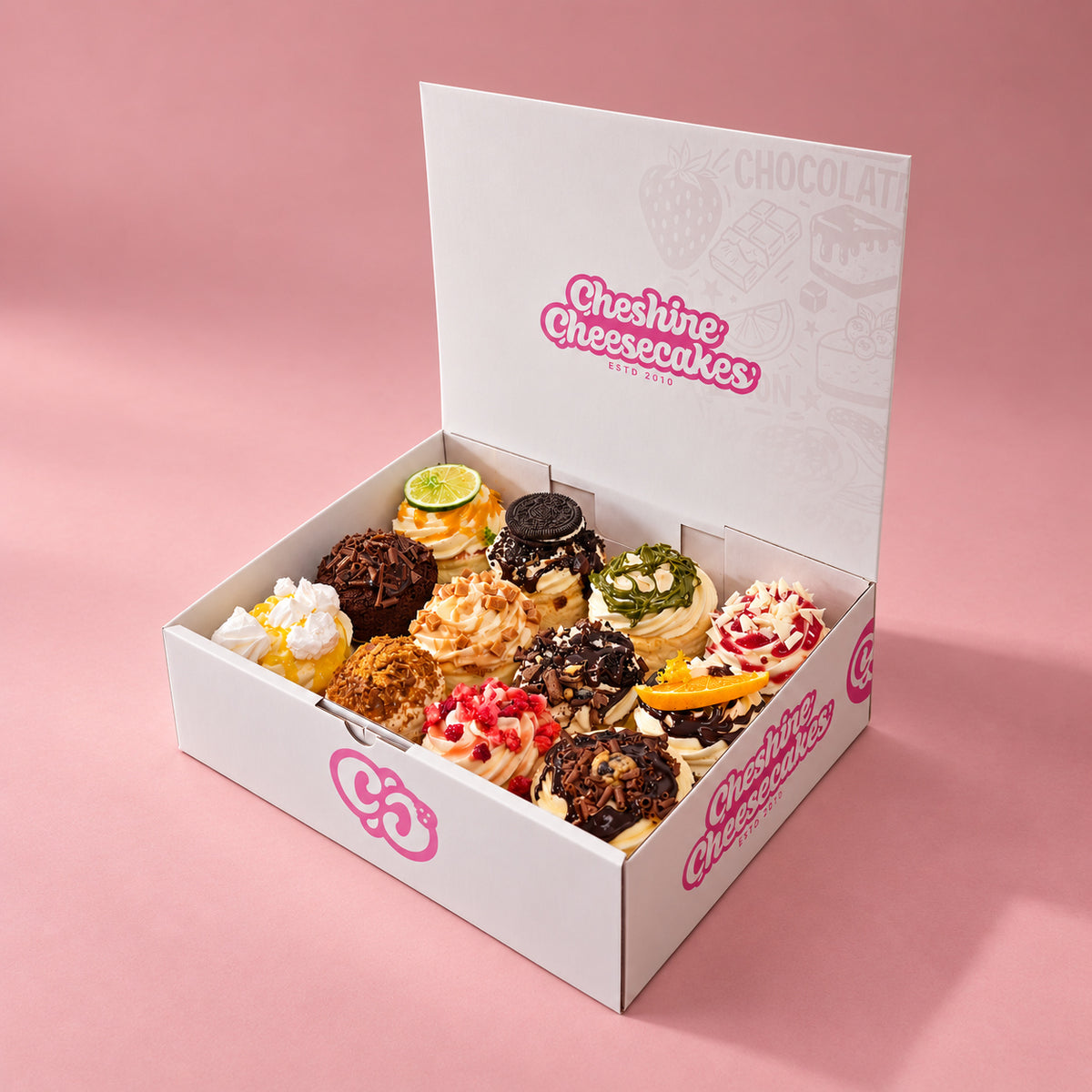 Build Your Own Cheesecake Box: example selection of 12 cheesecakes in our branded box on blush pink